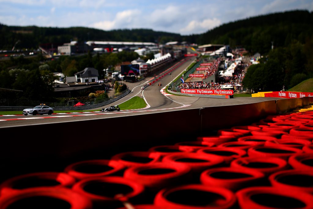 SPA, BELGIUM - AUGUST 28: (EDITORS NOTE: Image was created using a variable planed lens.) The safety car drives ahead of Nico Rosberg of Germany and Mercedes GP Daniel Ricciardo of Australia drives the Red Bull Racing Red Bull-TAG Heuer RB12 TAG Heuer during the Formula One Grand Prix of Belgium at Circuit de Spa-Francorchamps on August 28, 2016 in Spa, Belgium (Photo by Dan Istitene/Getty Images)